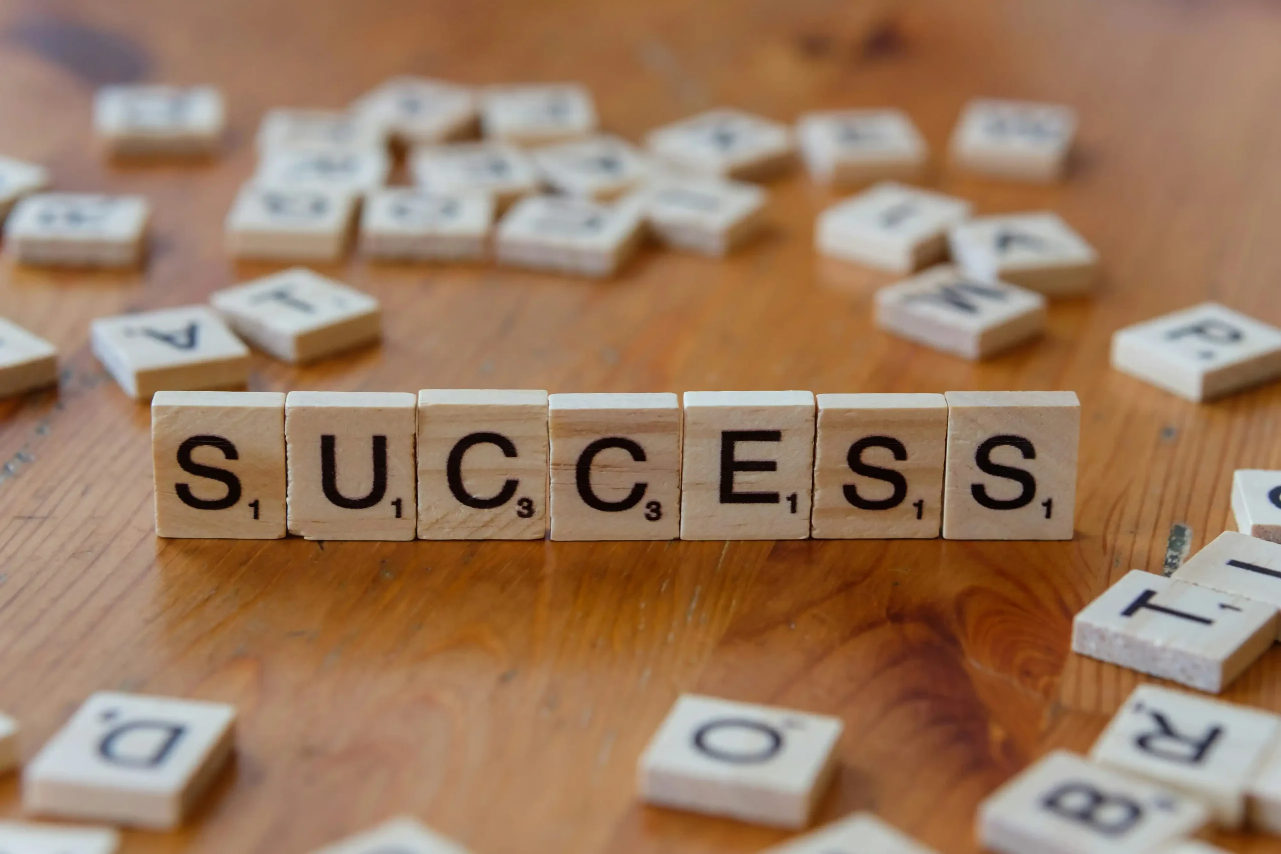 The word success spelled out by srabble pieces